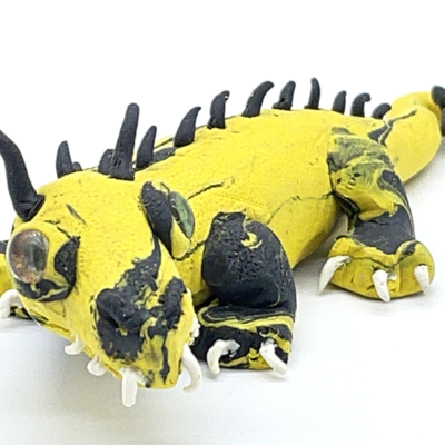 A yellow and black dragon with spikes along it's spine.