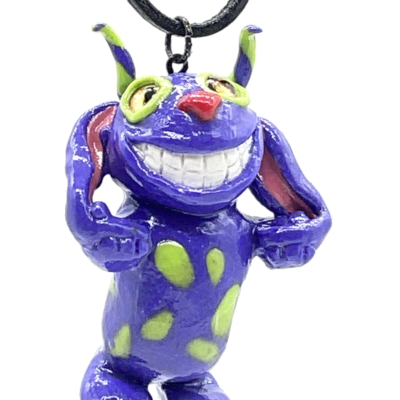 Smiling purple and lime green creature with long ears necklace.