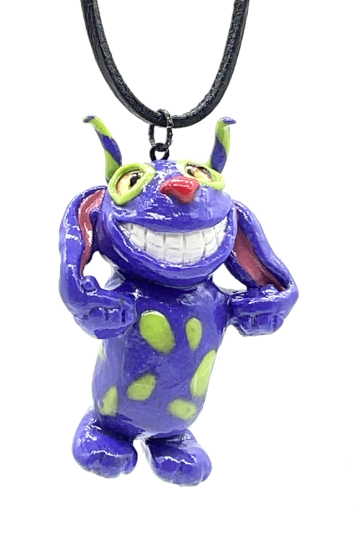 Smiling purple and lime green creature with long ears necklace.